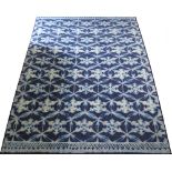 A rectangular carpet with blue and green pattern 200X300cm.