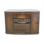 A NordMende Arabella 57E combination radio / gramophone, with cupboards on both sides for storage,