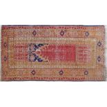 An antique Anatolia Turkish hand made wool carpet 110X210cm. Low pile, some parts no pile.