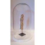 A wood sculpture in glass dome on marble plinths, H47cm, W28cm.