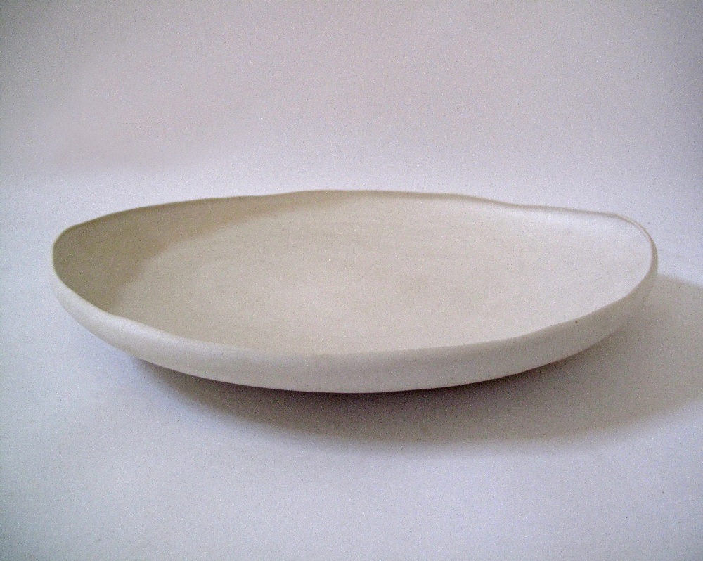 A Modern ceramic dish in off white clay by Rina Menardi W60cm.