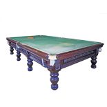 A late 19th century mahogany full size snooker table 205X385cm H83cm. The slate bed table with
