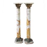 A pair of Victorian, green alabaster onyx cylindrical pedestals / columns, having square top with