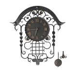 A Swiss vintage wrought iron wall clock, the dial with brass Roman numerals, with pendulum and