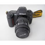Nikon F100 35mm film Camera Body together with a Nikon Nikkor 35-105mm F/3.5-4.5 Macro Late