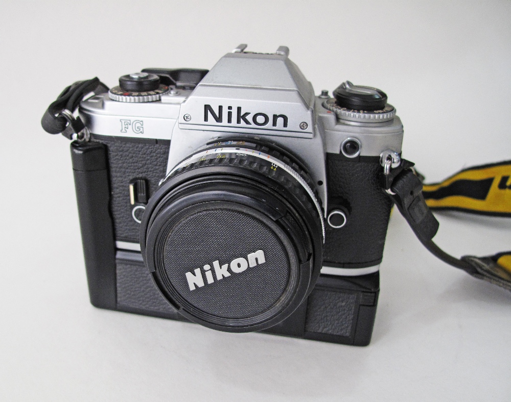 Nikon film camera FG for film with motor drive together with a Nikon Nikkor 50mm F/1.8 G AF-S