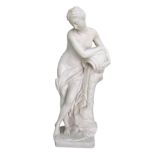 A reconstituted white marble statue of a partialy nude woman pouring water from a jug. Set on a