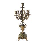 A gilt spelter candelabra for five candles, the base mounted on green onyx. H61cm.