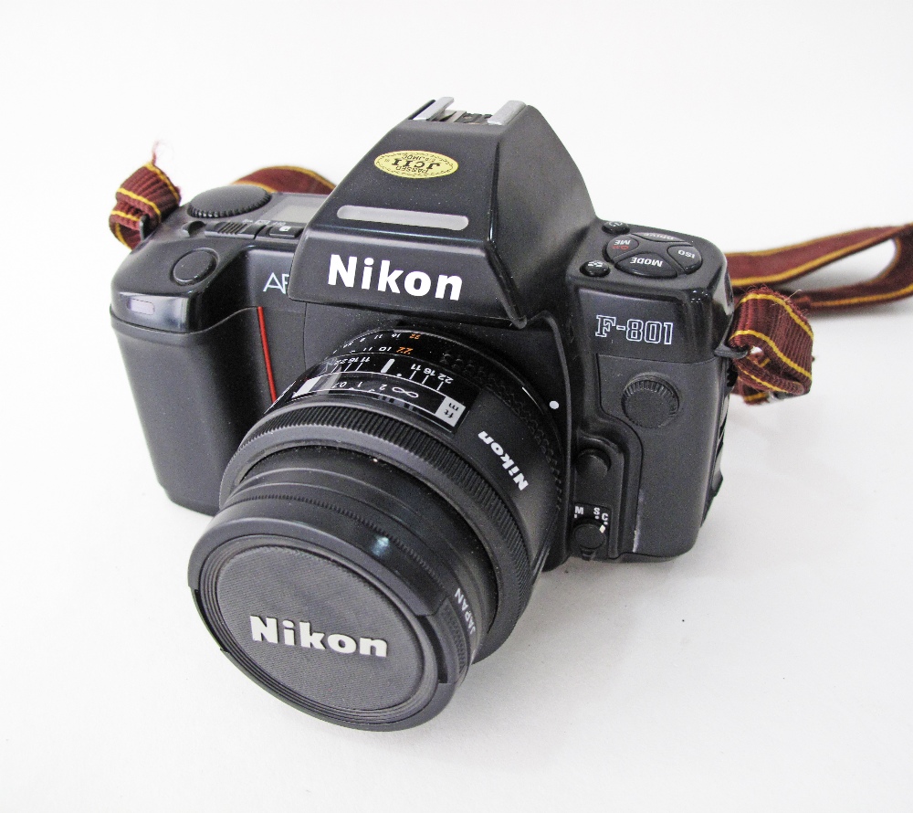 Nikon film camera F801 AF autofocus, together with Nikon Nikkor 24mm F/2.8 Autofocus Lens.