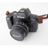 Nikon film camera F801 AF autofocus, together with Nikon Nikkor 24mm F/2.8 Autofocus Lens.