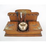 An oak pipe & cigar tidy box with a brass tobacco lidded box, together with three pipes and