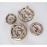 A Vietnamese set of four silver mounted porcelain ashtrays, the Chinese porcelain bowls decorated