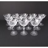 A collection of twelve hand cut lead crystal cocktail glasses. Three with chipped rims. (12)