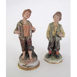 Two vintage Capodimonte porcelain figures of boys by V. Lamagna, H23cm and H21cm, one damaged and