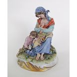 A vintage Capodimonte figure of a mother with children by Roberto Brambilla, raised over a