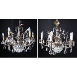 A pair of six light crystal chandeliers with silvered metal arms, H55cm, W75cm. (2)