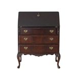 A Chippendale style mahogany veneered secretaire / slant front desk with three drawers on cabriole