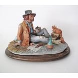 A Capodimonte porcelain figure of an old man and his squirrel, late 20th/ early 21st century. H18cm,