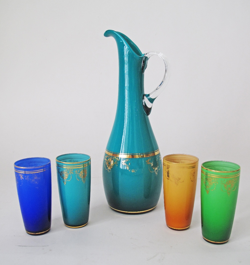 Mid century Murano glass pitcher with 4 glasses, some gilding, the bottle H38cm, the glasses H13.