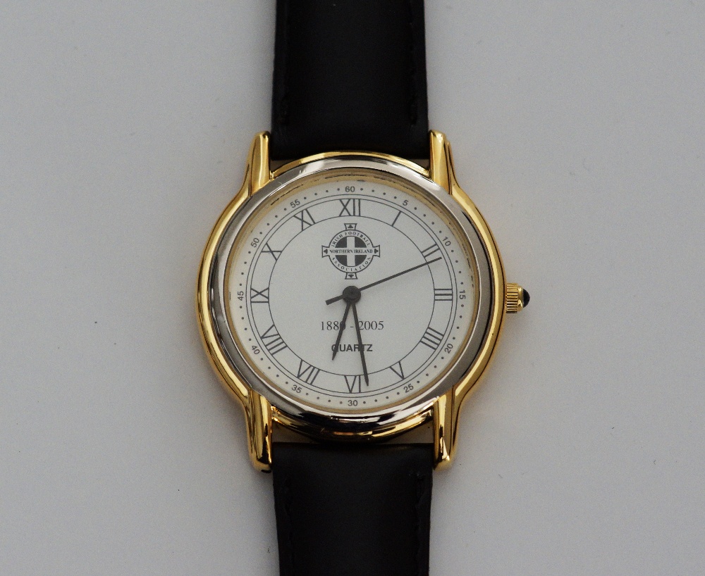 A gold plated and stainless steel Quartz movement wrist watch, the round white dial with Roman