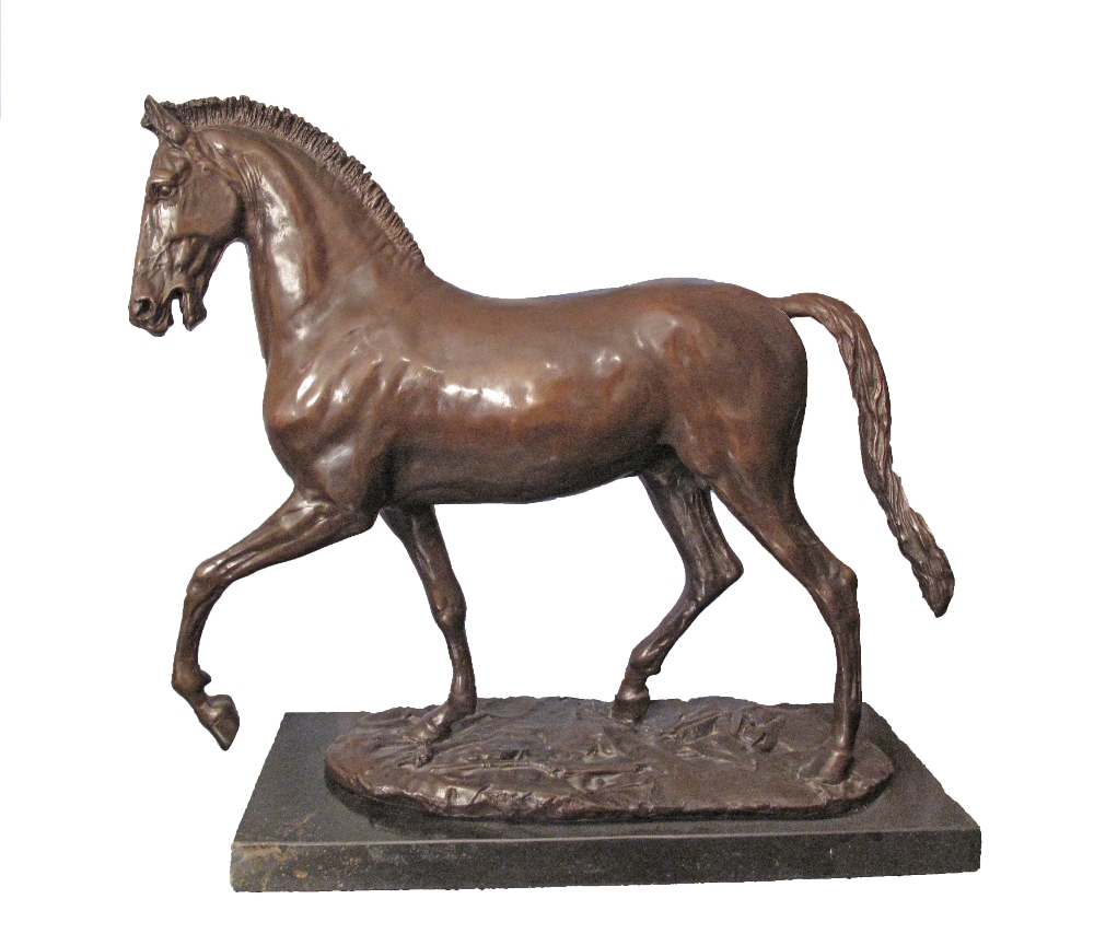 A patinated bronze figure of a prancing horse on a black marble base, late 20th / early 21st