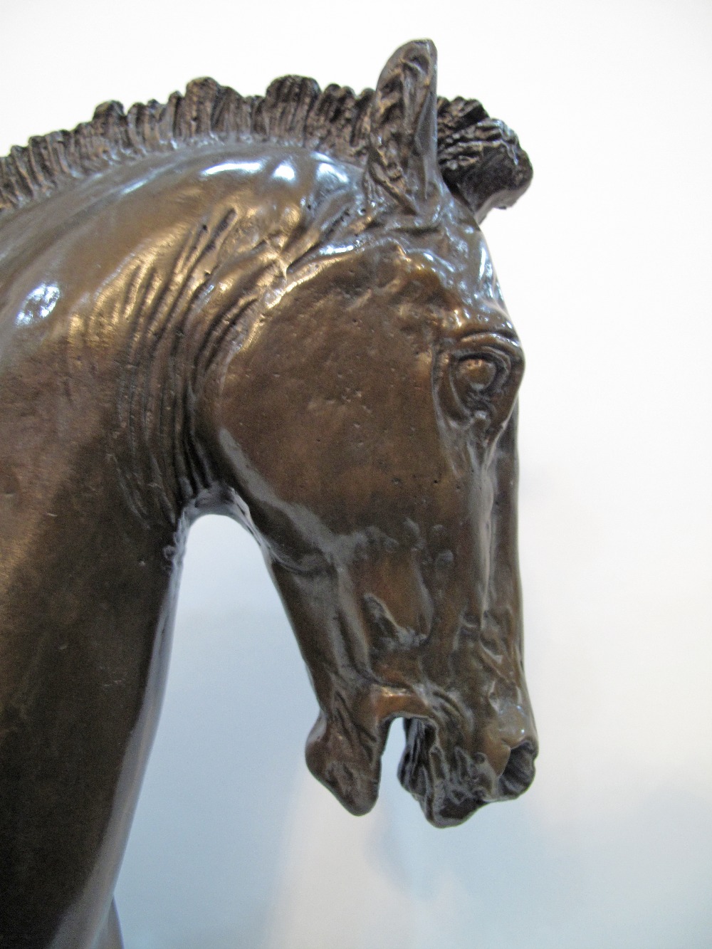 A patinated bronze figure of a prancing horse on a black marble base, late 20th / early 21st - Image 10 of 13