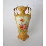 An Art Nouveau Austrian porcelain two handled vase, signed on the bottom G B & C, the body decorated