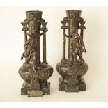 A pair of Large French Art Nouveau Patinated Spelter Figural Vases, c. 1910, the tapered bulbous