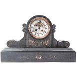 A late 19th Century slate mantel clock with eight day movement striking on a bell, the two piece