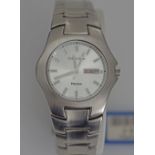 A Japanese Precision Quartz wrist watch, stainless steel case 36mm, water resistant, white dial with