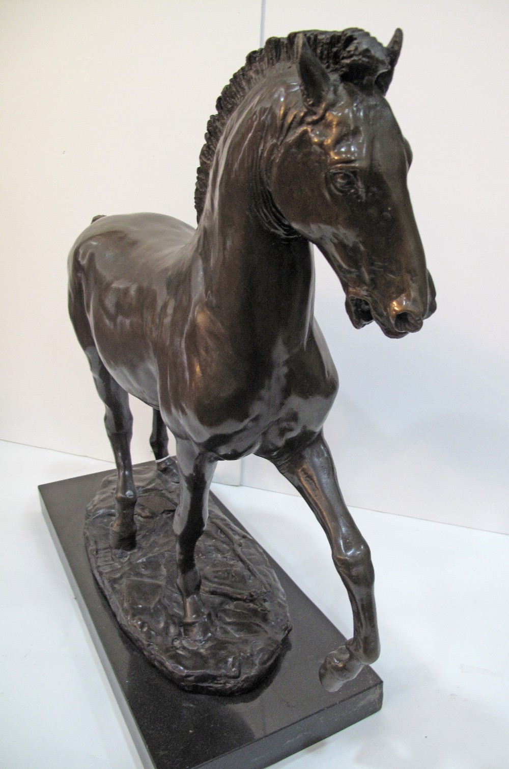 A patinated bronze figure of a prancing horse on a black marble base, late 20th / early 21st - Image 9 of 13