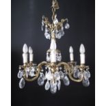 A brass and crystal six light chandelier, W60cm, H60cm.