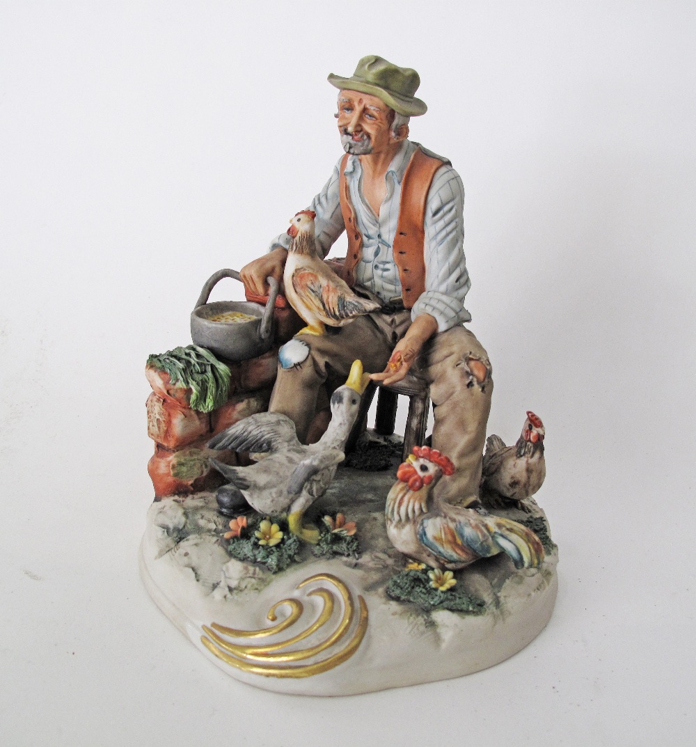 A Capodimonte porcelain figure of an old man with his chickens, late 20th/ early 21st century.