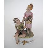 A vintage Capodimonte Porcelain figure of a seated boy and a standing girl with a dog by V. Lamagna.