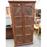 Tall Wooden Cupboard with Lattice Panel Doors