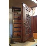 Collectors Cabinet with Carved Panel to Door and Six Drawers Inside