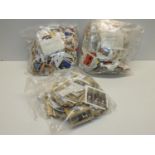 GB Stamps - 3x Bags on Paper - 1x Bag of Christmas Issues, 1x Bag of Millennium Issues and 1x Bag of