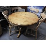 Circular Pine Pedestal Table and 4x Pine Slat Back Chairs