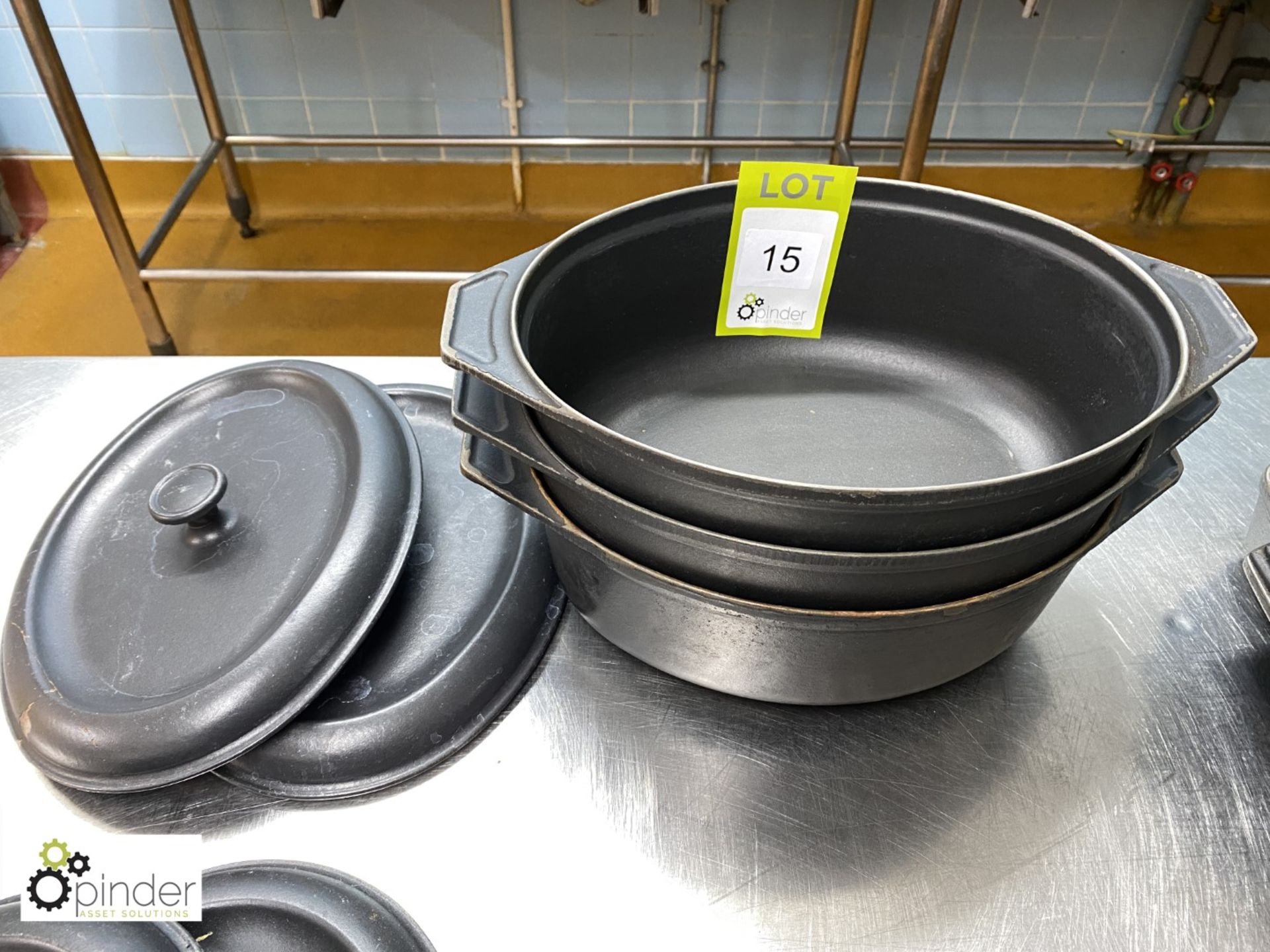 3 cast iron Casserole Dishes, with 2 lids (located in Main Kitchen)