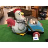 China Tin Toy Hen Me603 Battery Operated Mother Hen Pushing Baby Chicks In Cart . Battery Operated .