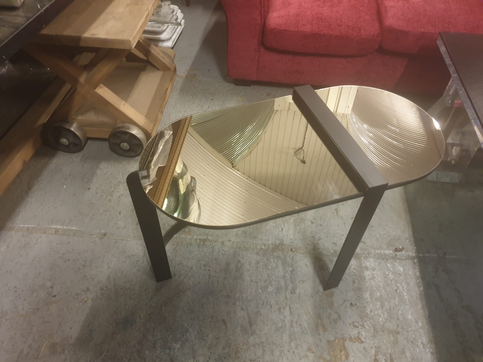 Mirrored glass coffee table with matt black metal frame and legs. 83 x 42 x 52cm condition is
