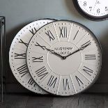 Metal Wall Clock Stunningly designed with a dark grey metal frame, this clock features roman numeral