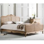 Annecy Cane 5' Bed Weathered This Anmecy Chic bedstead features a natural woven rattan headboard and