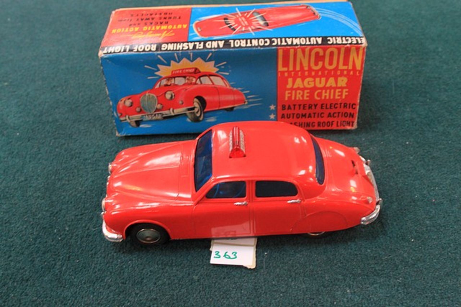 LINCOLN INTERNATIONAL 1960s BATTERY OPERATED JAGUAR FIRE CHIEF CAR IN THE ORIGINAL BOX 8 1/2" L