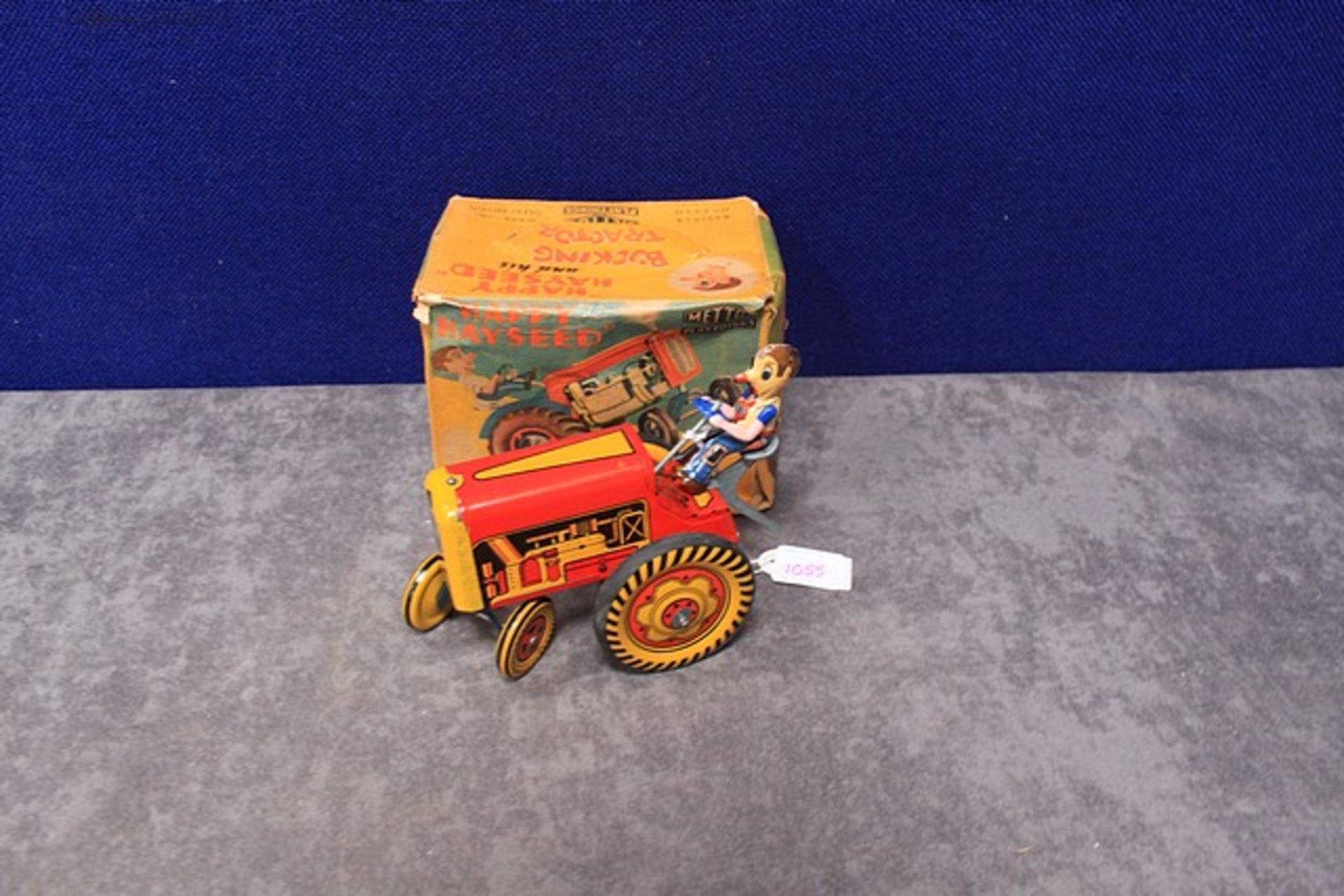 Mettoy Playthings rare wind up tin Happy Hayseed and his bucking Tractor Article no 6430 in box