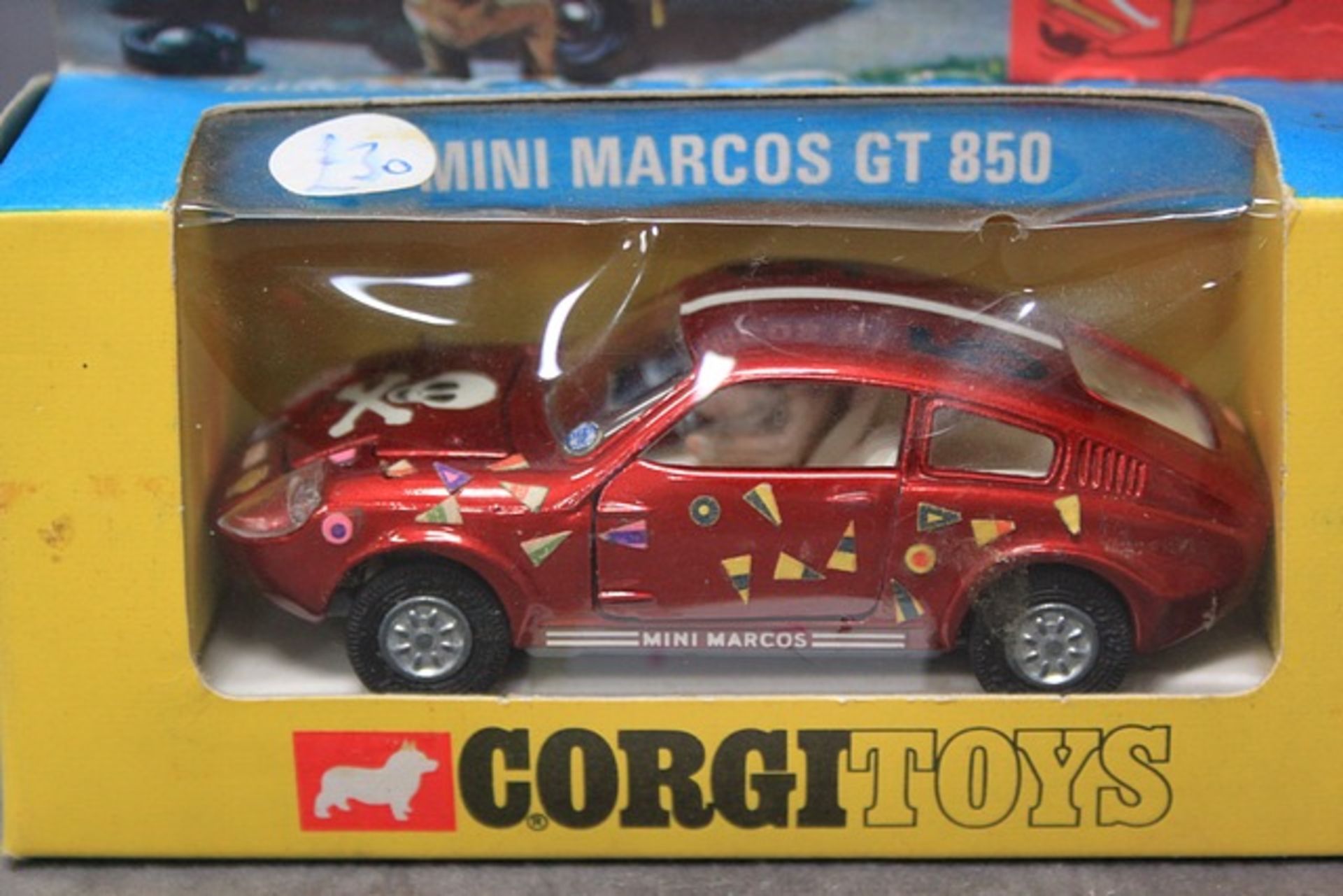 Corgi Toys diecast number341 Mini Marcos GT 850 with take off wheels and four buit in Golden Jacks