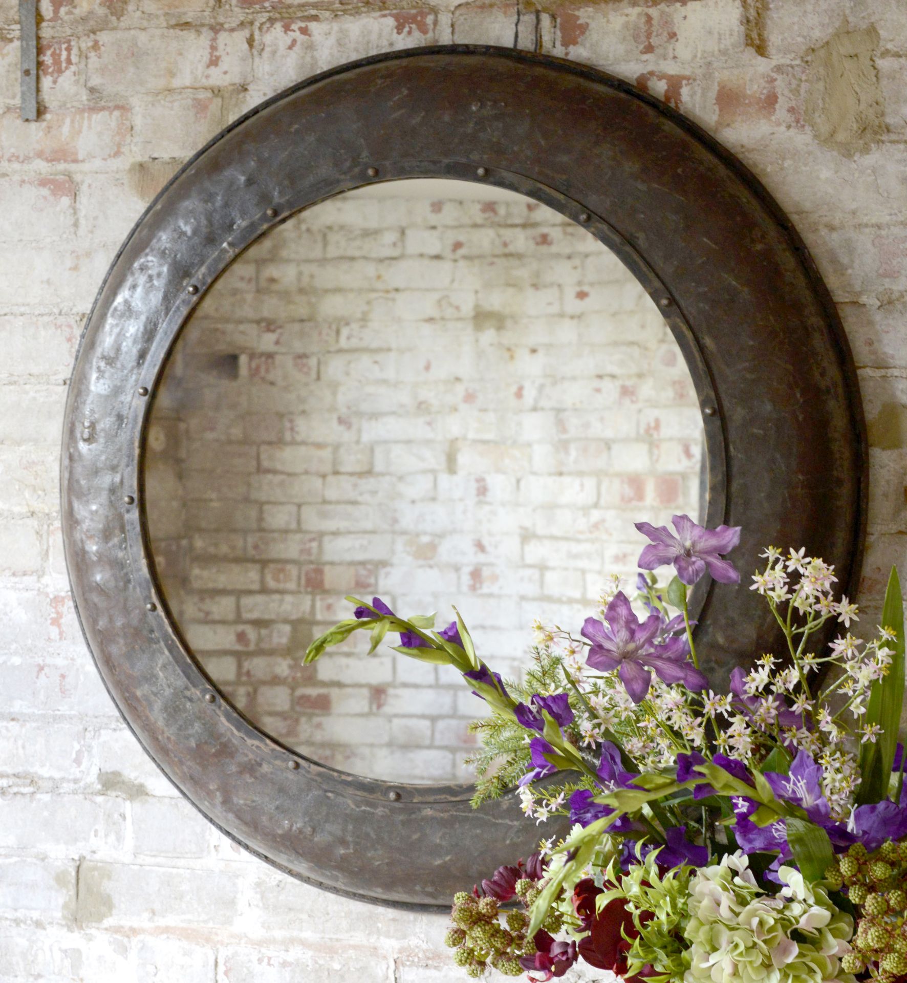 Iron Mirror: This iron framed mirror will lend a rustic and stylish look to any interior.