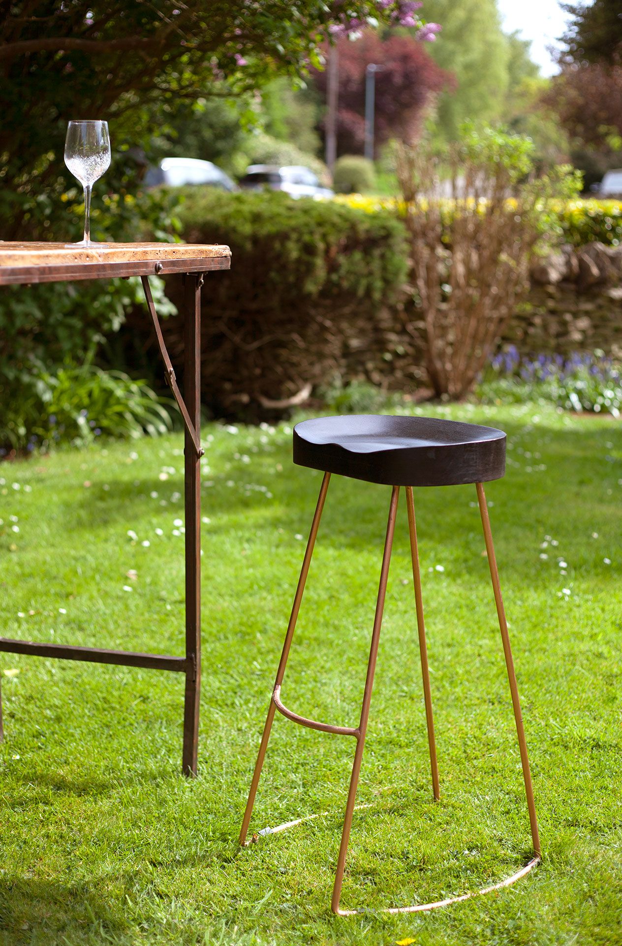 Tall Black Wood and Copper Stool: A gorgeous high bar stool with an ergonomic seat.