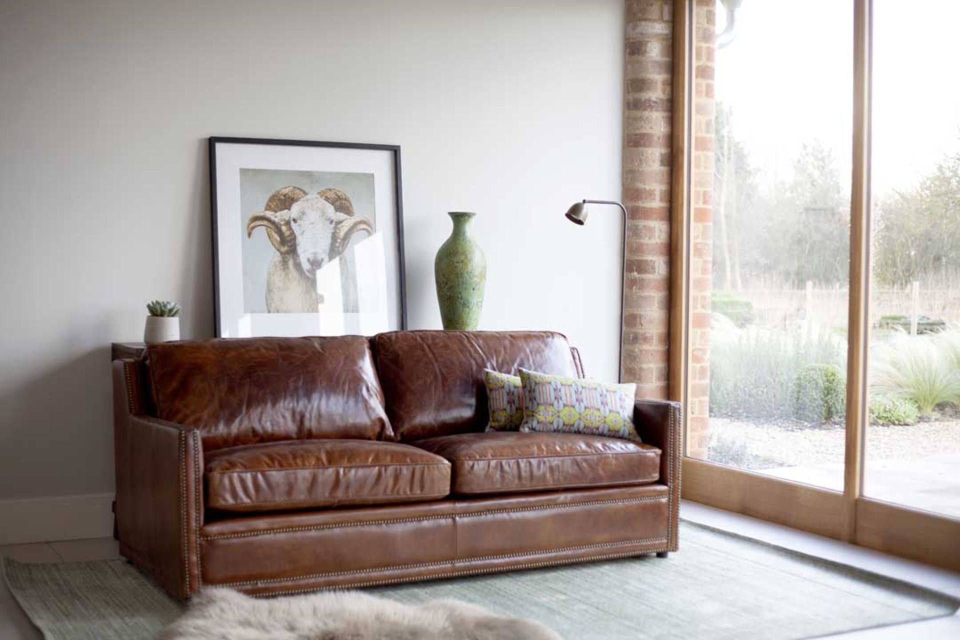 Rustic Leather Sofa - Brown: Inspired by classic design, this sofa boasts luxurious shining leather. - Image 2 of 5
