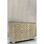 This beautiful Indian cabinet is both striking and elegant with intricately carved doors contrasting